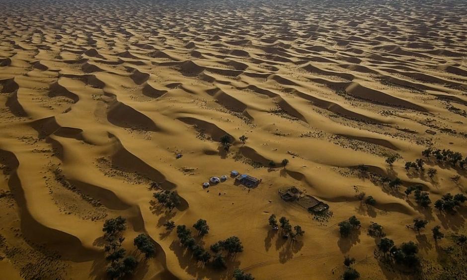 The Tengger desert in Inner Mongolia. Government efforts to halt the expansion of deserts have included tree-planting projects and restrictions on grazing. Photo: Josh Haner, The New York Times