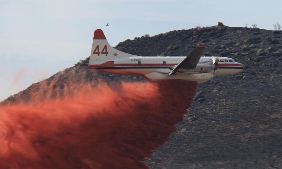 An air tanker drops retardant on the wildfire burning near Idaho Falls. Fire officials announced Sunday that the blaze was nearly 70 percent contained. Photo: Eastern Idaho Interagency Fire Center