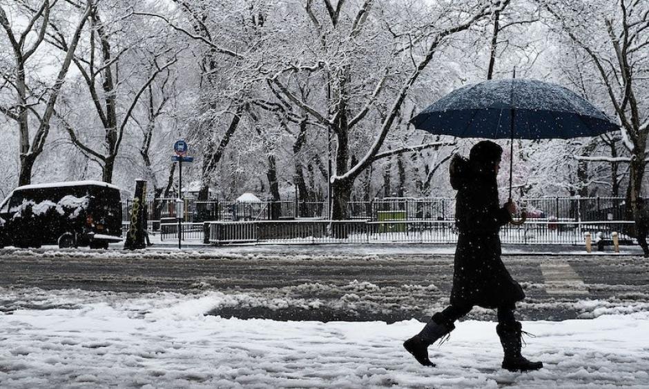 A pedestrian walks in the morning snow during an early spring storm on April 2, 2018 in New York City. The daily snowfall total of 5.5” in Central Park was the heaviest for any April day since 1982 and the seventh heaviest one-day April snow in records going back to 1869. Photo: Spencer Platt, Getty Images
