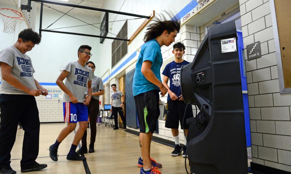 Gym teacher Neal Finch cools off in front of a large Portacool Cooling system set up to help cool off the gym during classes at KIPP Denver Collegiate High School on Sept. 24, 2018 in Denver. Photo: Helen H. Richardson, The Denver Post