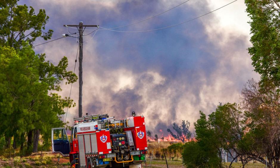 Emergency crews tackle a bushfire at Boggabri, one of dozens across NSW during the heatwave. Photo: Karen Hodge, AAP