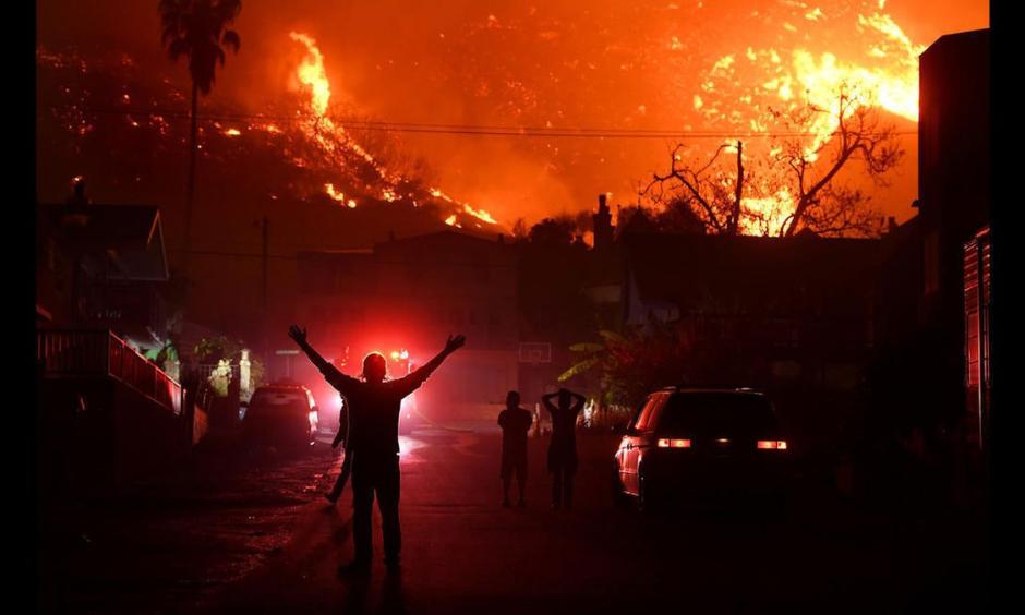 Residents watch the Thomas fire burn in the hills above La Conchita in Ventura County. Photo: Wally Skalij, Los Angeles Times
