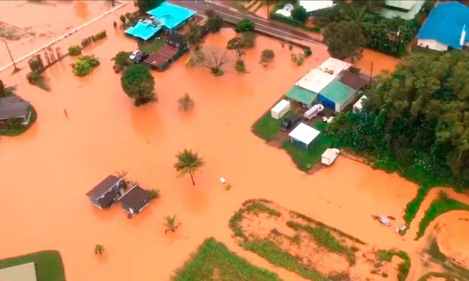 Floodwaters on the Hawaiian island of Kauai turned orange, a sign of the high iron content in the volcanic soil. Photo: Brandon Verdura, Associated Press