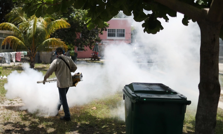 A Miami-Dade County mosquito control inspector sprays pesticide in the Wynwood neighborhood. Photo: Joe Raedle / Getty Images