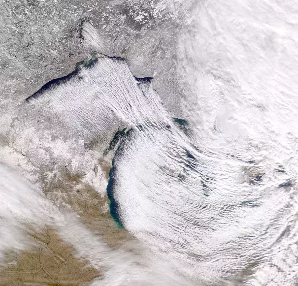 Cold northwesterly wind over Great Lakes Superior and Michigan created the lake-effect snowfall. Photo: Robert Nemiroff and Jerry Bonnell