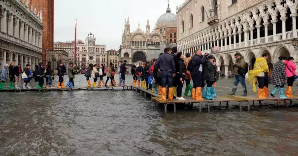 Visitors to Saint Mark’s Square in Venice used raised walkways on Monday. Photo: Manuel Silvestri, Reuters