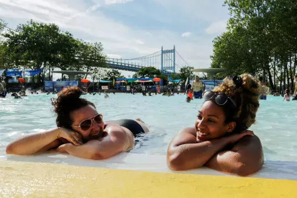 Women enjoy a day in the pool in the Queens borough of New York, during a heat wave on July 24, 2016. Credit: Eduardo Munoz, Reuters