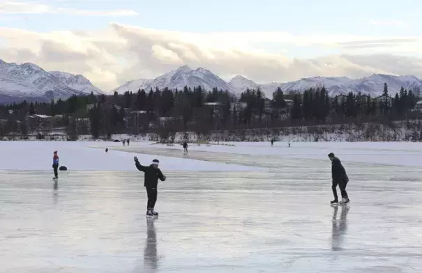 In this January 2, 2018 file photo, ice skaters take advantage of unseasonably warm weather to skate outside at Westchester Lagoon in Anchorage, Alaska. Photo: Mark Thiessen, AP