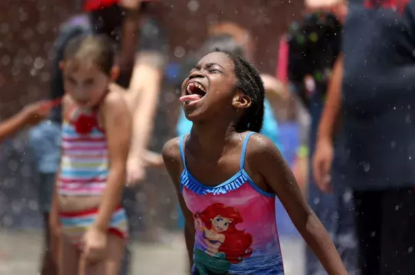 Hundreds of area children enjoyed playing in the water and being sprayed during Big Splash Day at the Joe on July 13. Forecasters say a well-deserved break from the extreme heat and humidity is on the way as we enter August. Photo: Grace Beahm