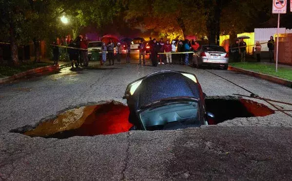 Sinkhole swallows two cars in Studio City. Photo: Los Angeles Times