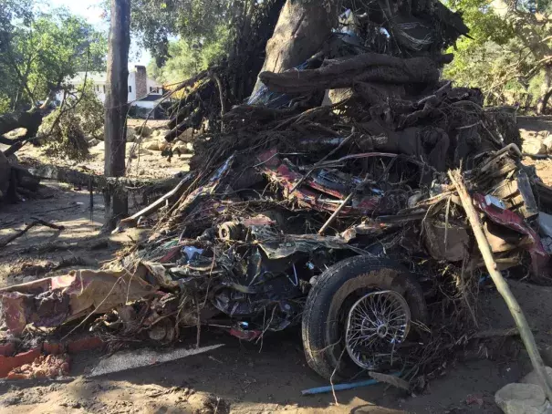 This crumbled car shows the force of the mudslide as debris roared through Montecito. Photo: James Cook via Twitter @BBCJAmesCool