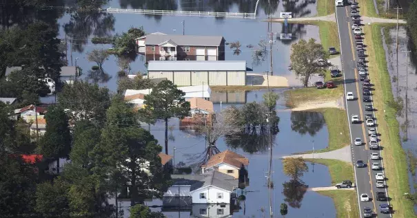 Floodwaters are seen surrounding homes after heavy rains from Hurricane Florence on September 20, 2018, in Lumberton, North Carolina. The rainfall from Hurricane Florence was a 1,000-year event. Photo: Joe Raedle, Getty Images