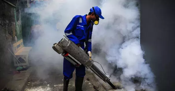 Officers fumigate informal living areas of Jakarta, Indonesia, on January 31, 2019, to prevent dengue fever and viruses caused by Aedes aegypti mosquitoes. Photo: Dasril Roszandi, NurPhoto via Getty Images