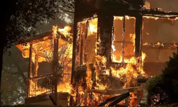 Flames consume a home as an out of control wildfire moves through the area, Oct. 9, 2017, in Glen Ellen, California. Photo: Justin Sullivan, Getty Images