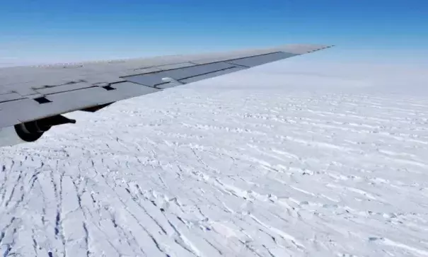 West Antarctica's massive Pine Island Glacier is seen out the window of NASA's DC-8 research aircraft as it flies at an altitude of 1,500 feet in October 2009. Pine Island Glacier is one of the fastest-retreating glaciers in Antarctica. Click image to enlarge. Photo: Jane Peterson, NASA