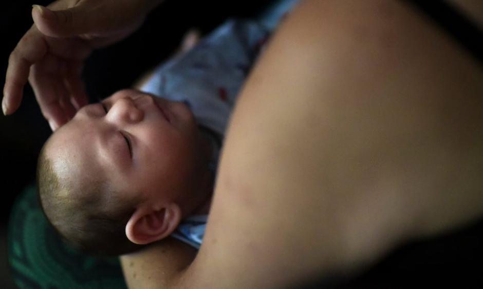 A mother in Puerto Rico and her 2-month-old son who was diagnosed with microcephaly linked to the Zika virus. Photo: Carlos Giusti, Associated Press