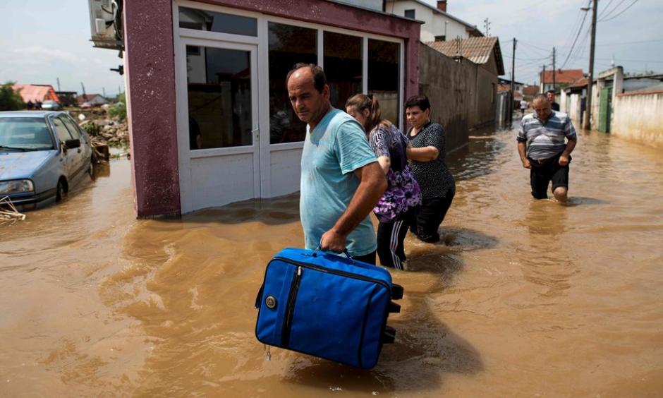 People fled their flooded homes Sunday in the village of Stajkovci, near Skopje, Macedonia. Photo: Robert Atanasovski/Agence France-Presse