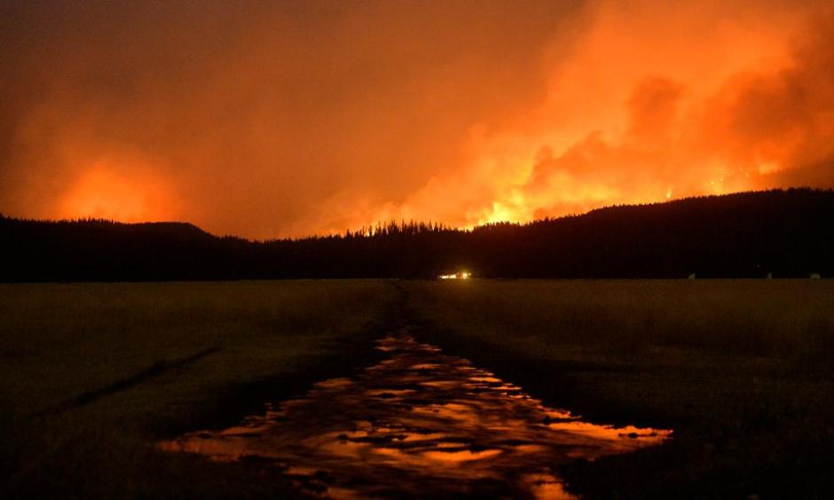 A wildfire burned in the Lolo National Forest near Salmon Lake in Montana in August. Credit Rion Sanders/The Great Falls Tribune, via Associated Press