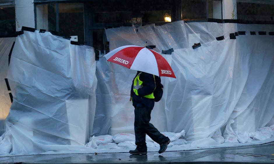 Storefronts were covered against a deluge in San Anselmo, in Marin County. Photo: Jeff Chiu, Associated Press