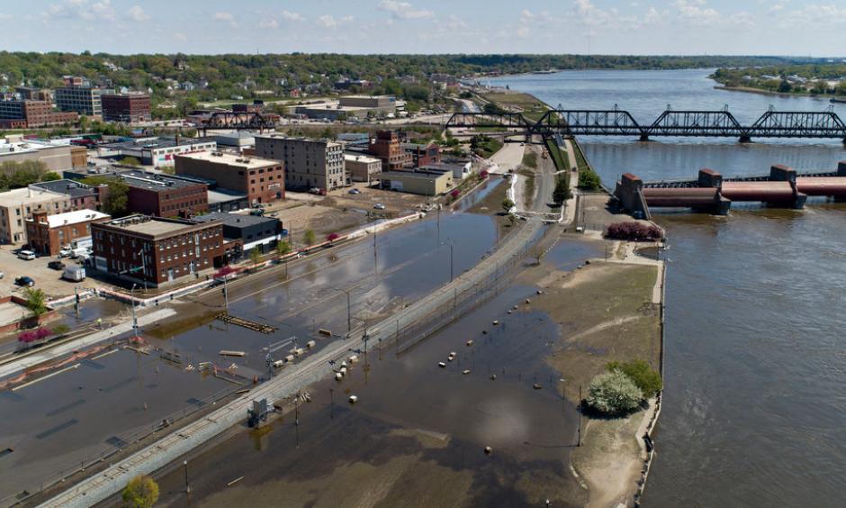 The Mississippi River, which gushed into downtown Davenport, Iowa, at record levels two weeks ago, has finally retreated toward its banks. Credit: Daniel Acker for The New York Times