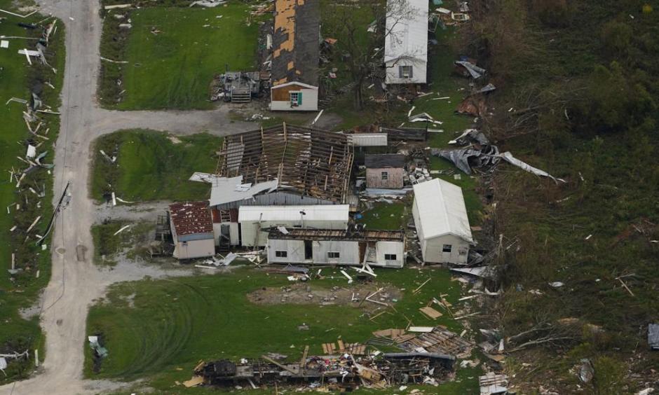 In this aerial photo, the remains of destroyed homes are seen in the aftermath of Hurricane Ida, Sept. 6, 2021, in Lafitte, La. Damage wrought by Hurricane Ida in the U.S. state of Louisiana and the flash floods that hit Europe last summer have helped make 2021 one of the most expensive years for natural disasters. Reinsurance company Munich Re said Monday, Jan. 10, 2022 that overall economic losses from natural disasters worldwide last year reached $280 billion. (AP Photo/Matt Slocum)