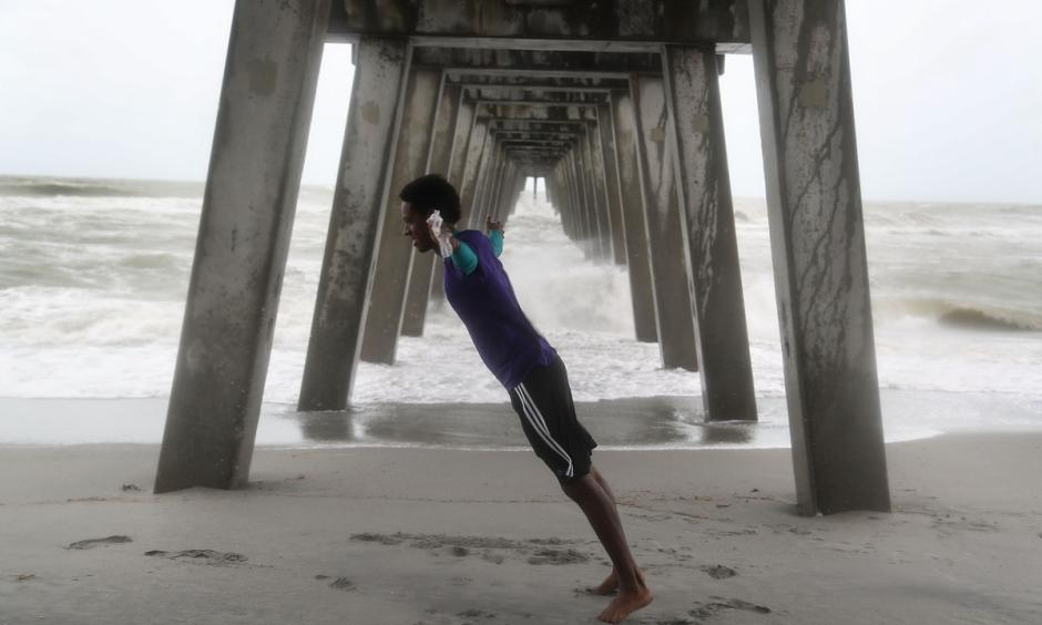 Casey Superville leans into the high winds from Tropical Storm Colin in Venice, Florida on Monday. Photo: Joe Raedle, Getty Images