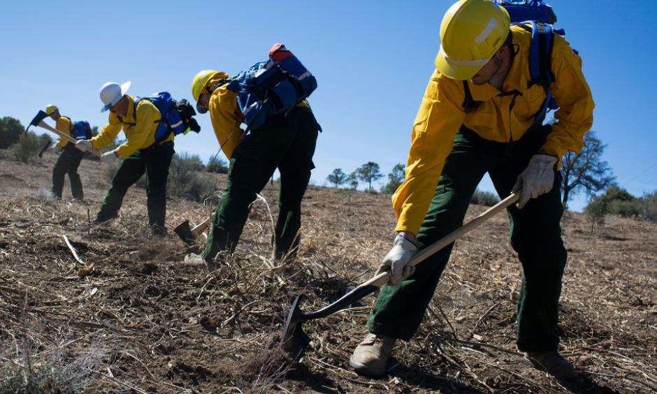 Trainees learned to dig a fire line at the Arizona Wildfire and Incident Management Academy at Embry-Riddle Aeronautical University in Prescott. The federal costs of fighting fires rose to $2 billion last year. Photo: Caitlin O'Hara, The New York Times