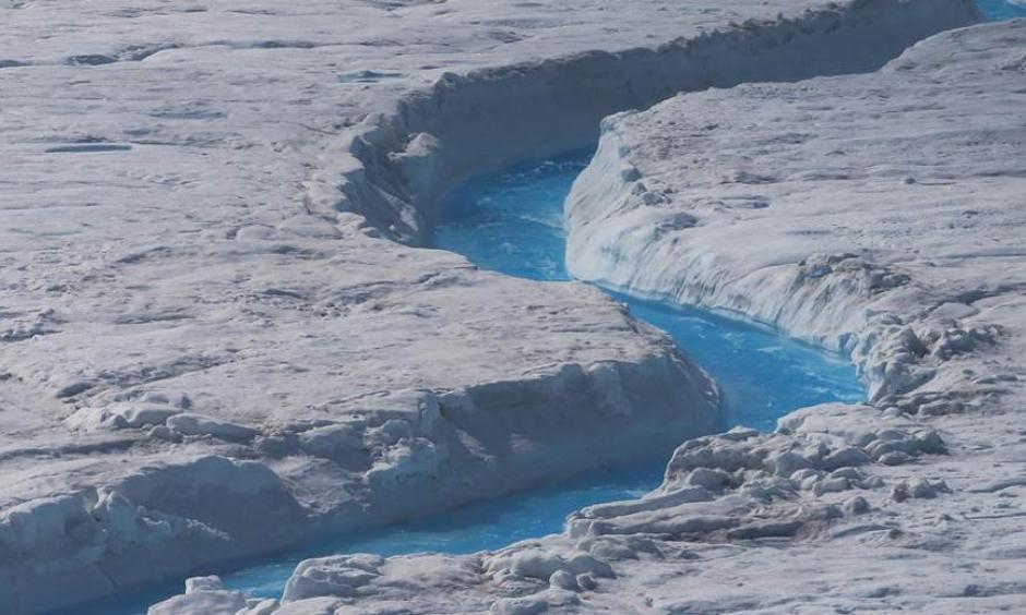 Water courses through Greenland's ice sheet during the summer melt on July 17, 2013. Photo: Joe Raedle, Getty Images