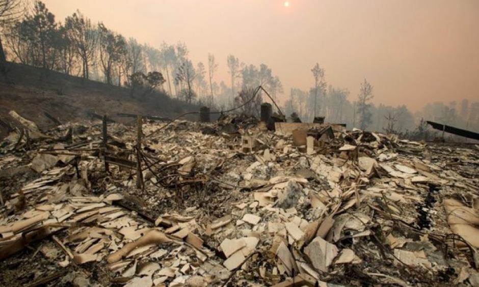 Rubble lines a residence leveled by the Loma fire along Loma Chiquita Road on Tuesday, Sept. 27, 2016, near Morgan Hill, Calif. Photo: Noah Berger, AP