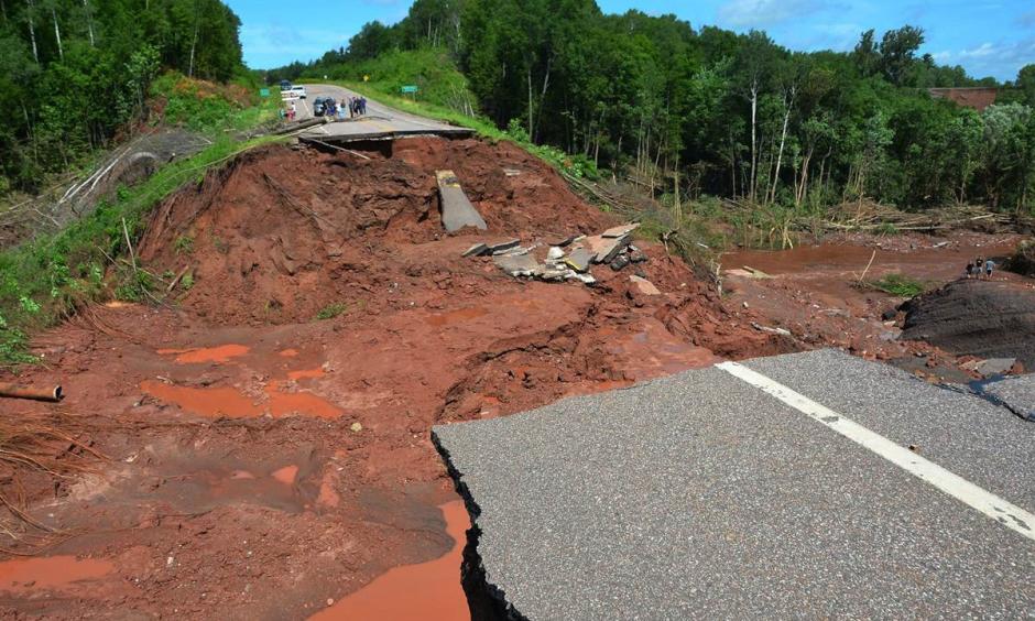 A section of Wisconsin Highway 13 is washed out after heavy rains, south of Highbridge in Ashland, Wis., on July 12. Photo: Jeff Peters / AP