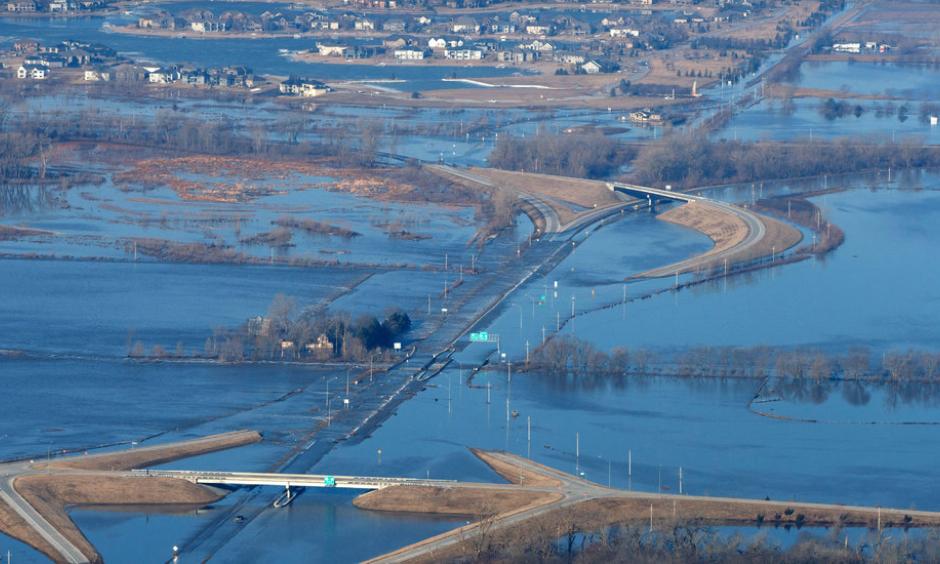 Rain, warm temperatures and snowmelt across the Midwest have caused floods that led to hundreds of evacuations and at least two deaths. Photo: Kent Sievers, Omaha World-Herald, via Associated Press