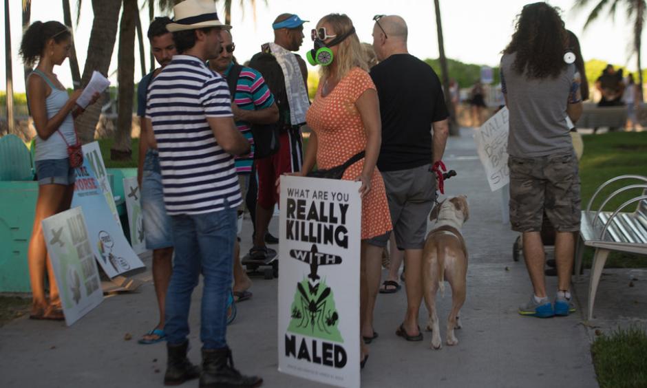 Demonstrators and Miami-Dade County residents during a protest in Miami Beach on Friday against the spraying of the pesticide naled. Photo: Max Reed for The New York Times