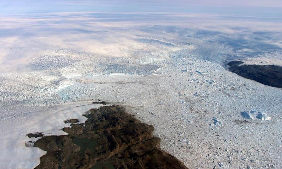 Patches of bare land are seen at the Jakobshavn glacier in Greenland in 2016, but the glacier ice has started to grow again, according to a study released on March 25, 2019. Study authors and outside scientists think this is temporary. Photo: NASA via AP