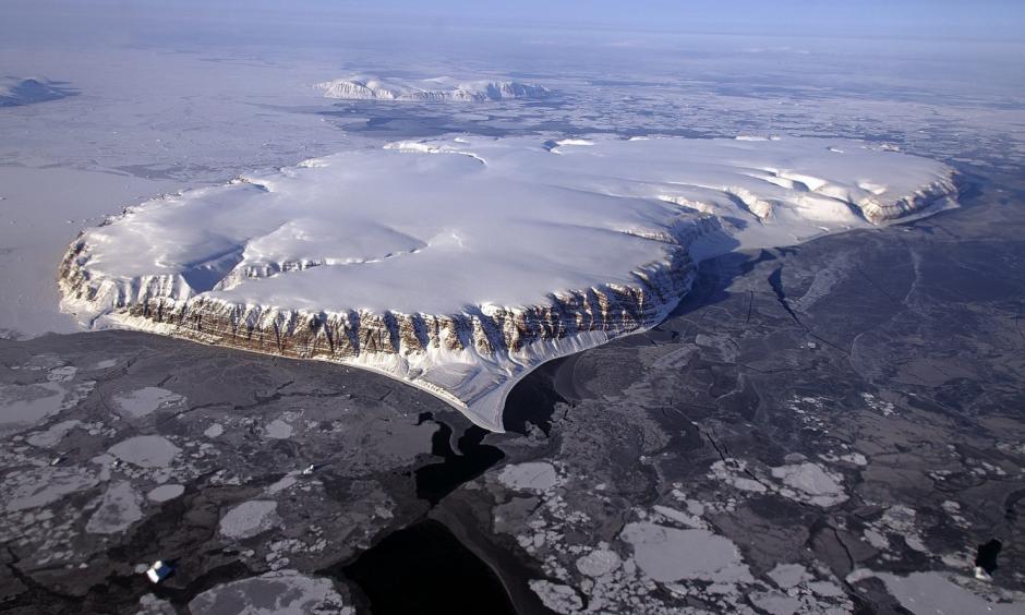 Saunders Island and Wolstenholme Fjord with Kap Atholl in the background are seen in an image taken during an Operation IceBridge survey flight of Greenland in April 2013. Photo: Michael Studinger, NASA/Reuters