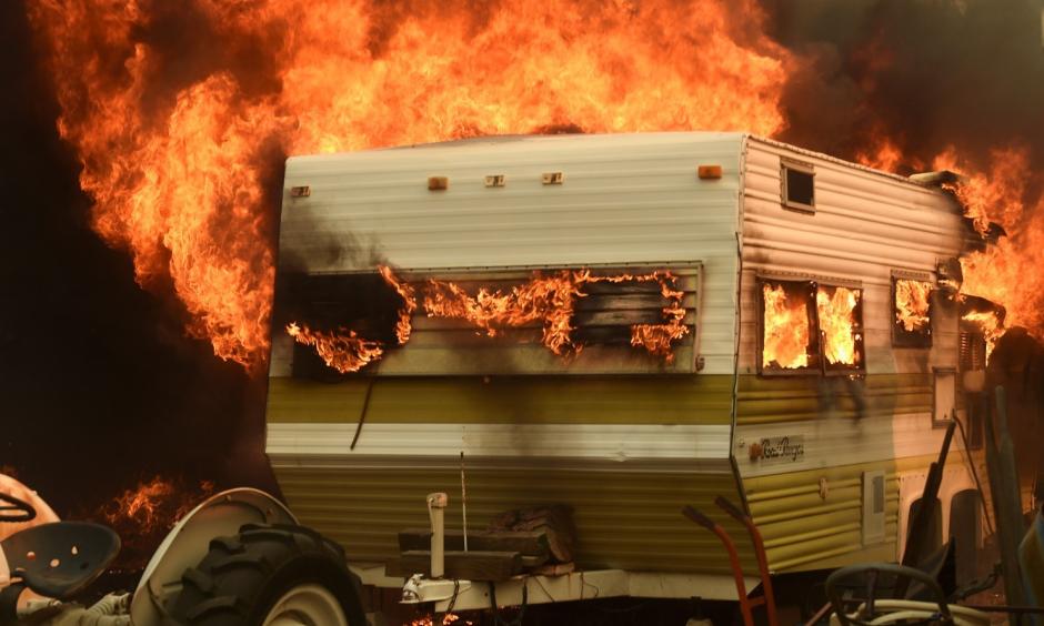 Flames from the Erskine fire engulf a trailer near Weldon, Calif., on June 24. Photo: Noah Berger / Reuters