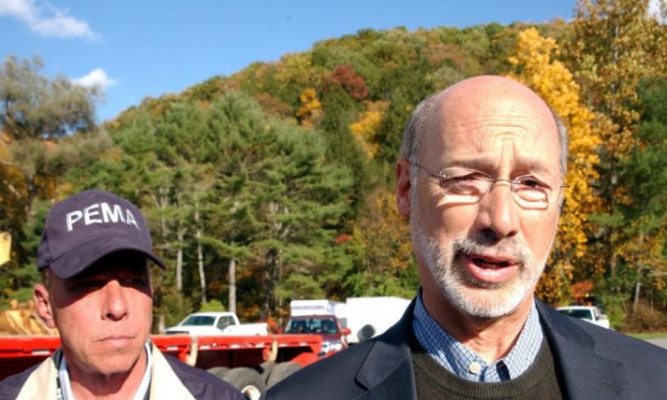 Gov. Tom Wolf speaks to the media in Warrensville Sunday after being briefed about the Sunoco pipeline break and flash flood damage in Lycoming County. At left is Richard D. Flinn, director of the Pennsylvania Emergency Management Agency. Photo: John Beauge