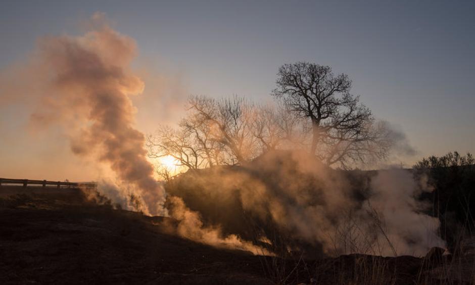 A highway west of Medicine Lodge, Kan. A wildfire that began on Tuesday in Oklahoma soon spread to Kansas. Photo: Craig Hacker, The New York Times