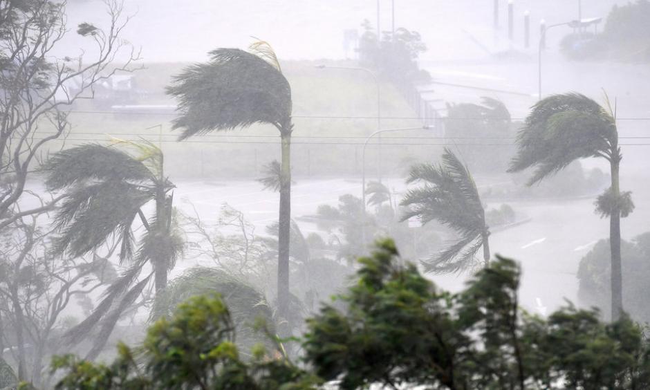Winds of up to 160 miles an hour hit the resort town of Airlie Beach on Tuesday, damaging roofs and knocking over palm trees. Photo: Dan Peled, Australian Associated Press, via Reuters