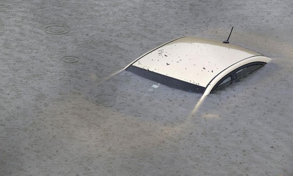 A submerged car on Interstate 610 North in Houston, as the city coped with flooding from the rain of Hurricane Harvey. Credit: Thomas Shea, Getty Images