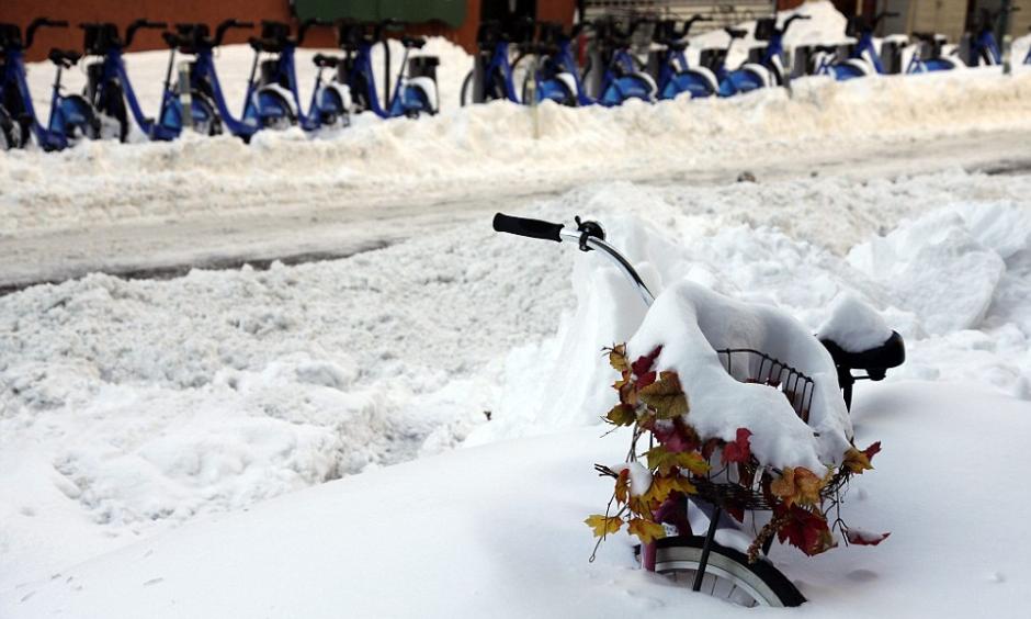 A snow covered bicycle is stuck in a snow bank on the the Lower East side, a day after winter storm Jonas hit New York Photo: EPA