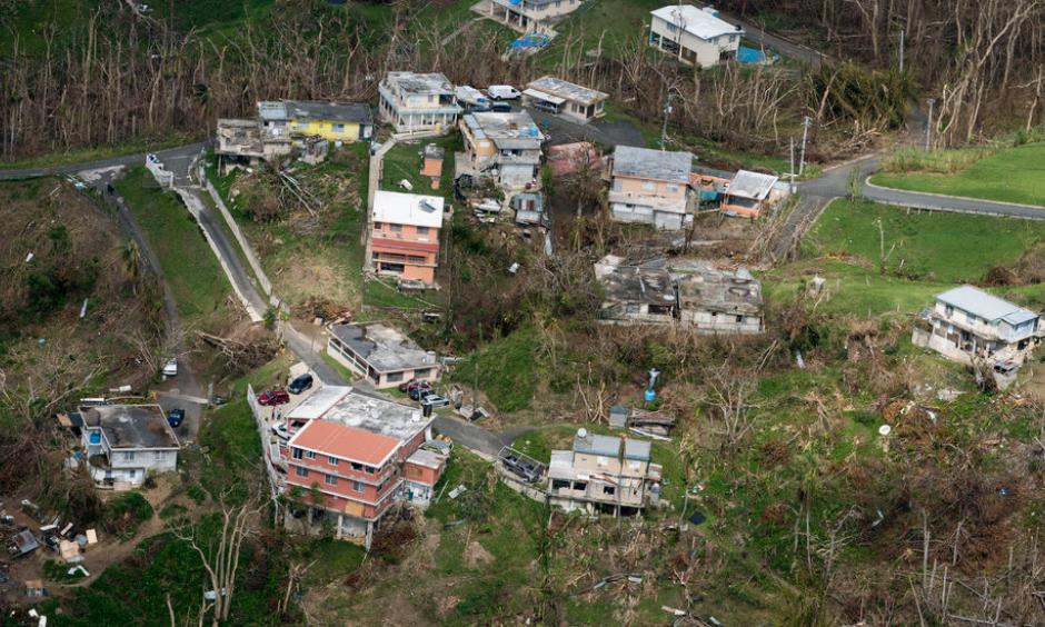 Houses that suffered damage from Hurricane Maria in San Juan, P.R., last October. Photo: Doug Mills, The New York Times