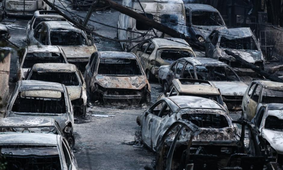 In Mati, many fled their cars and ran for the sea to try to escape the flames. By Tuesday morning, burned-out vehicles lined the coastal village. Photo: Nick Paleologos, SOOC/Al Jazeera