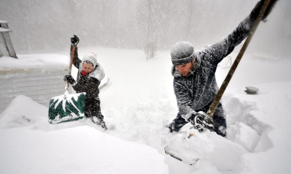 Hardy Buffalonians dig out from the massive storm. Photo: John Normile, Getty Images