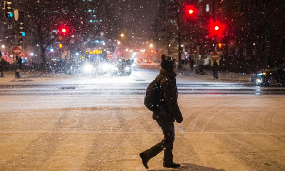A woman crosses the street as it snows in Washington, D.C., on Jan. 20, 2016. Get ready, D.C., it's about to get much, much worse. Photo: Andrew Cabellero-Reynolds, AFP/Getty Images