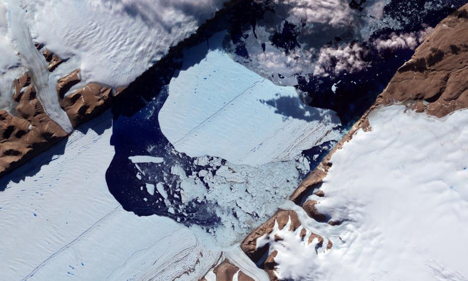 This NASA Earth Observatory image obtained July 27, 2012, shows a massive ice island as it broke free of the Petermann Glacier in northwestern Greenland. Photo: Jesse Allen and Robert Simmon, NASA Earth Observatory via AFP