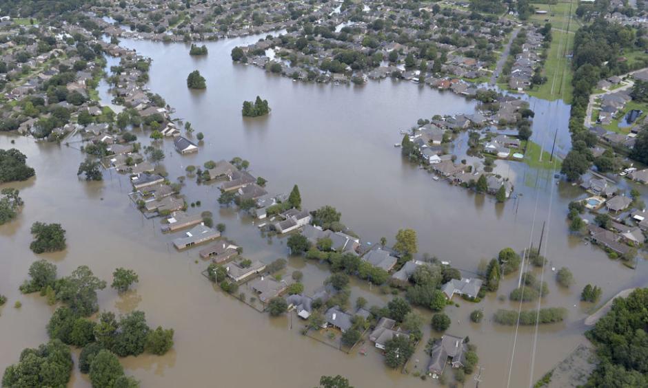 Homes are surrounded by water in the Manchac Harbor subdivision off LA-42. Aerials of severe weather flooding in Ascension Parish on Monday August 15, 2016. Photo: Bill Feig, The Advocate