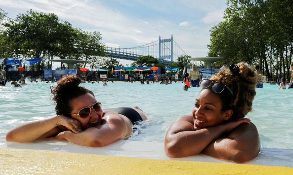 Women enjoy a day in the pool in the Queens borough of New York, during a heat wave on July 24, 2016. Credit: Eduardo Munoz, Reuters