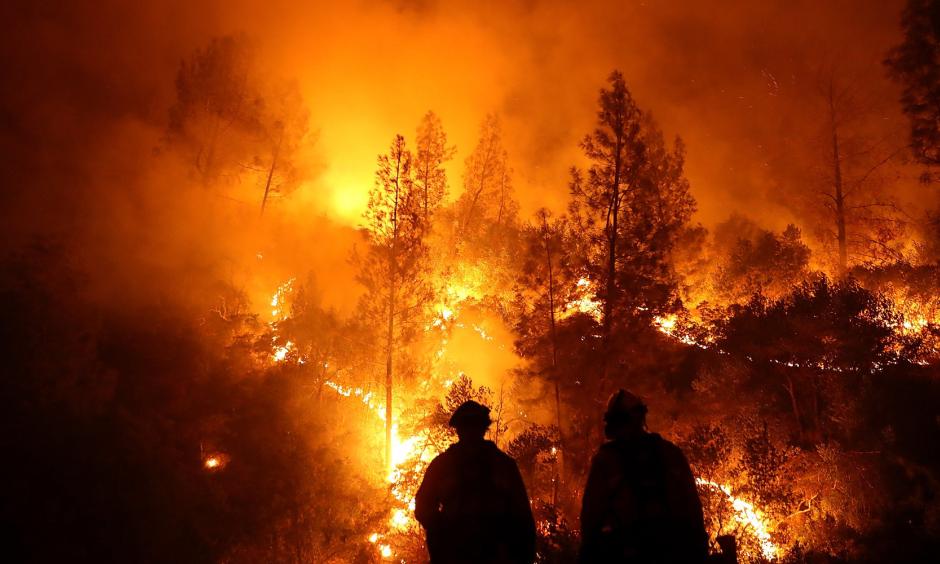 Firefighters battle the Mendocino Complex fire in Northern California. Photo: Justin Sullivan via Getty Images