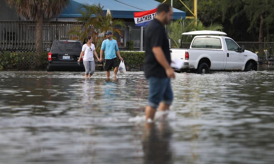 North Miami, Florida was flooded due to the effects of the magnified high tide of this week's unusually close full Moon. That, and the effects of decades of sea level rise due to global warming. Photo: Joe Raedle, Getty Images