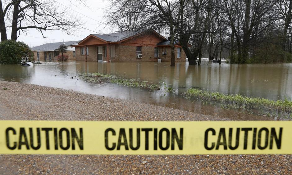 Caution tape closes off this neighborhood in Drew, Miss., Friday, March 11, 2016, as floodwaters have affected areas in the Delta. The flooding has affected the Delta to varying degrees. Photo: Rogelio V. Solis, AP